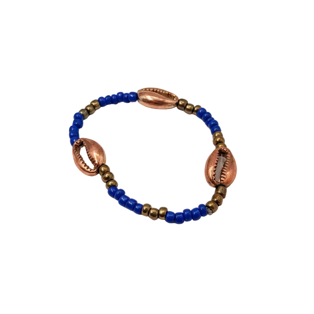 Bracelet with blue beads and cowrie shell-like accents on a light gray background